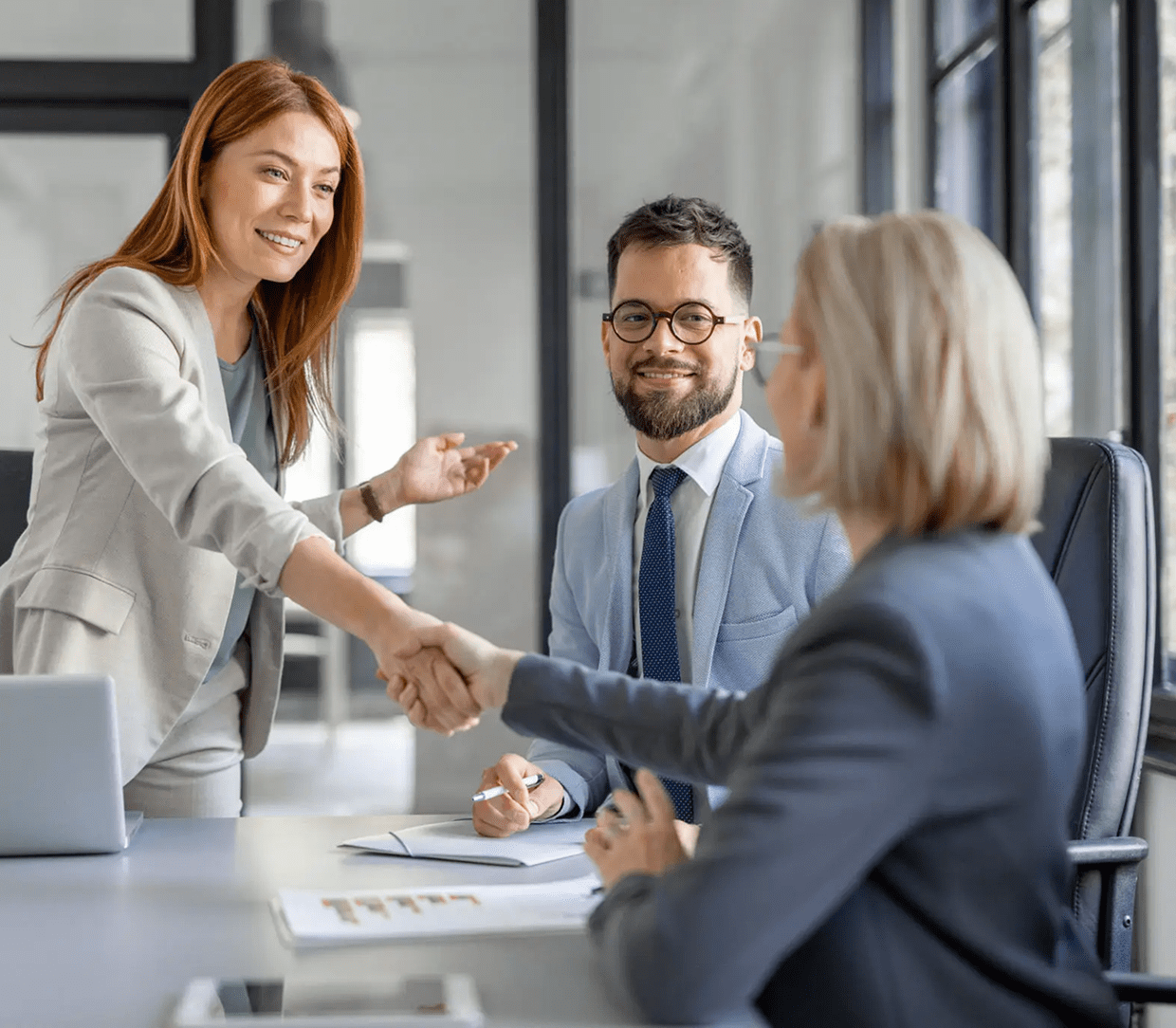Business handshake in office meeting